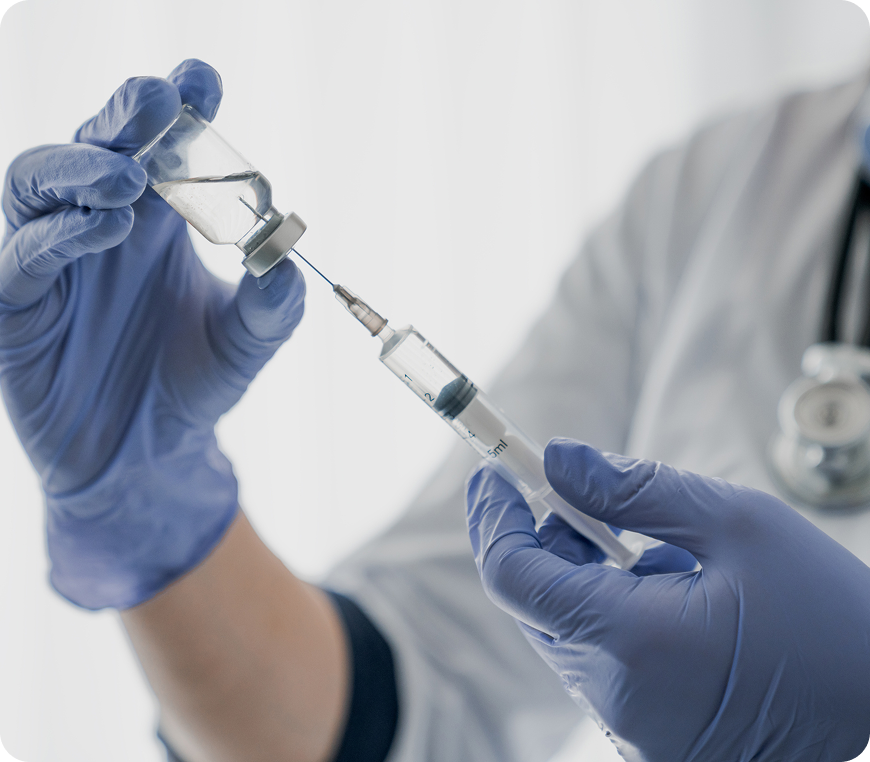 Healthcare professional handling a vaccine vial