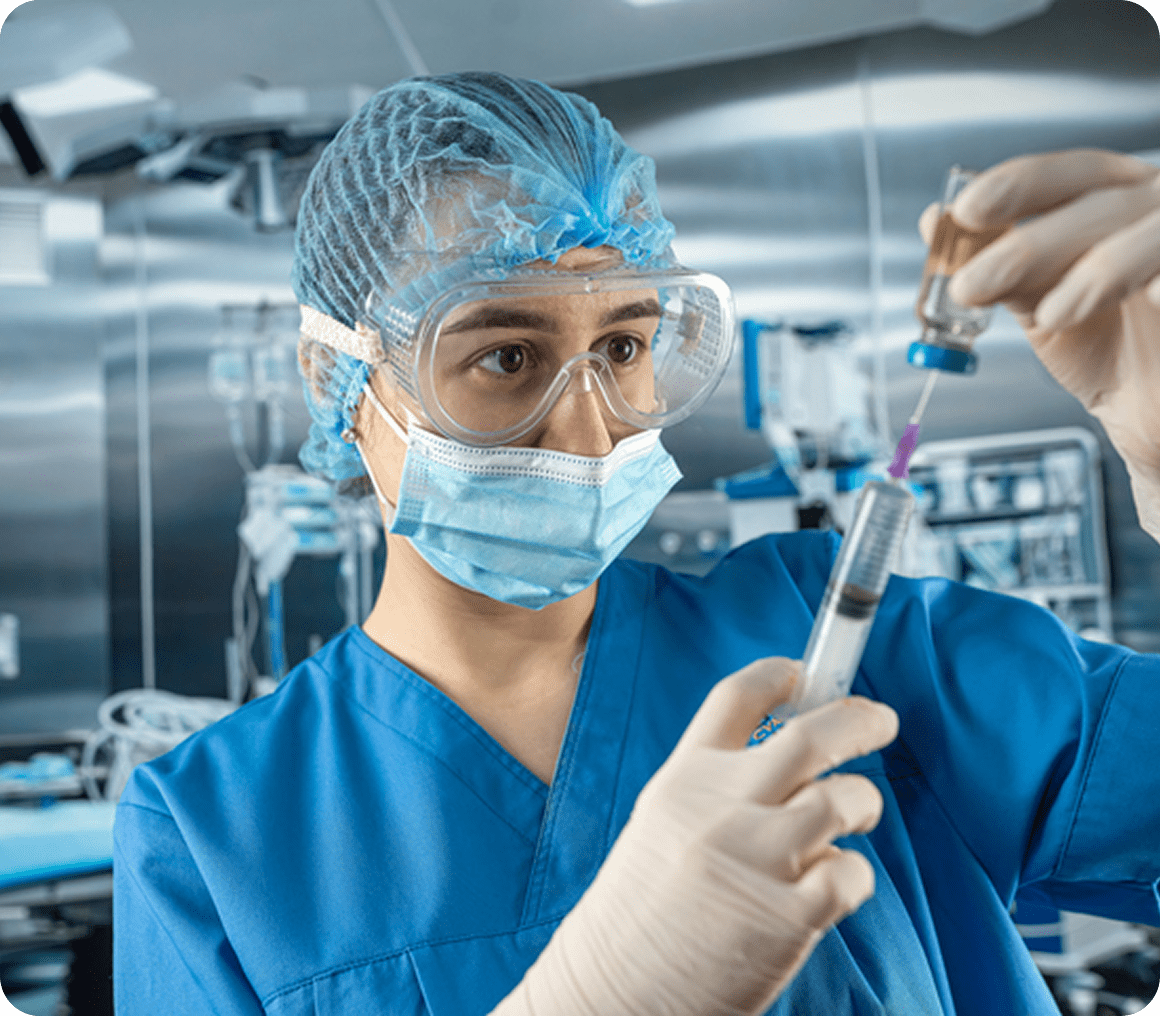 Healthcare worker handling a syringe carefully
