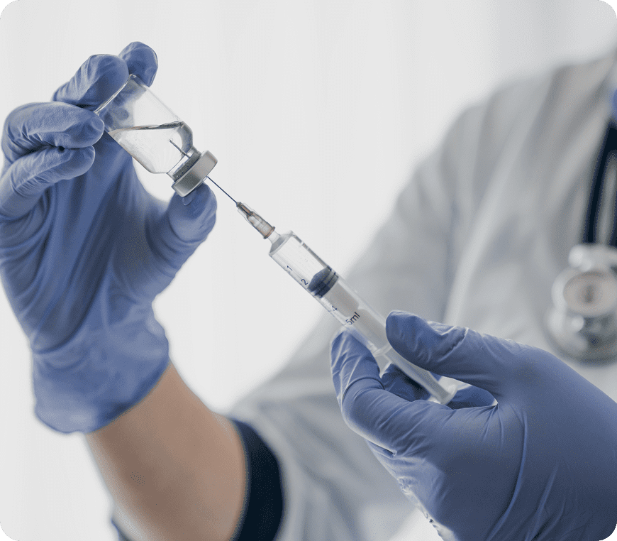 Healthcare professional handling a vaccine vial