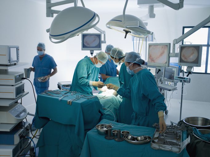 Surgical team working in an operating room during surgery.