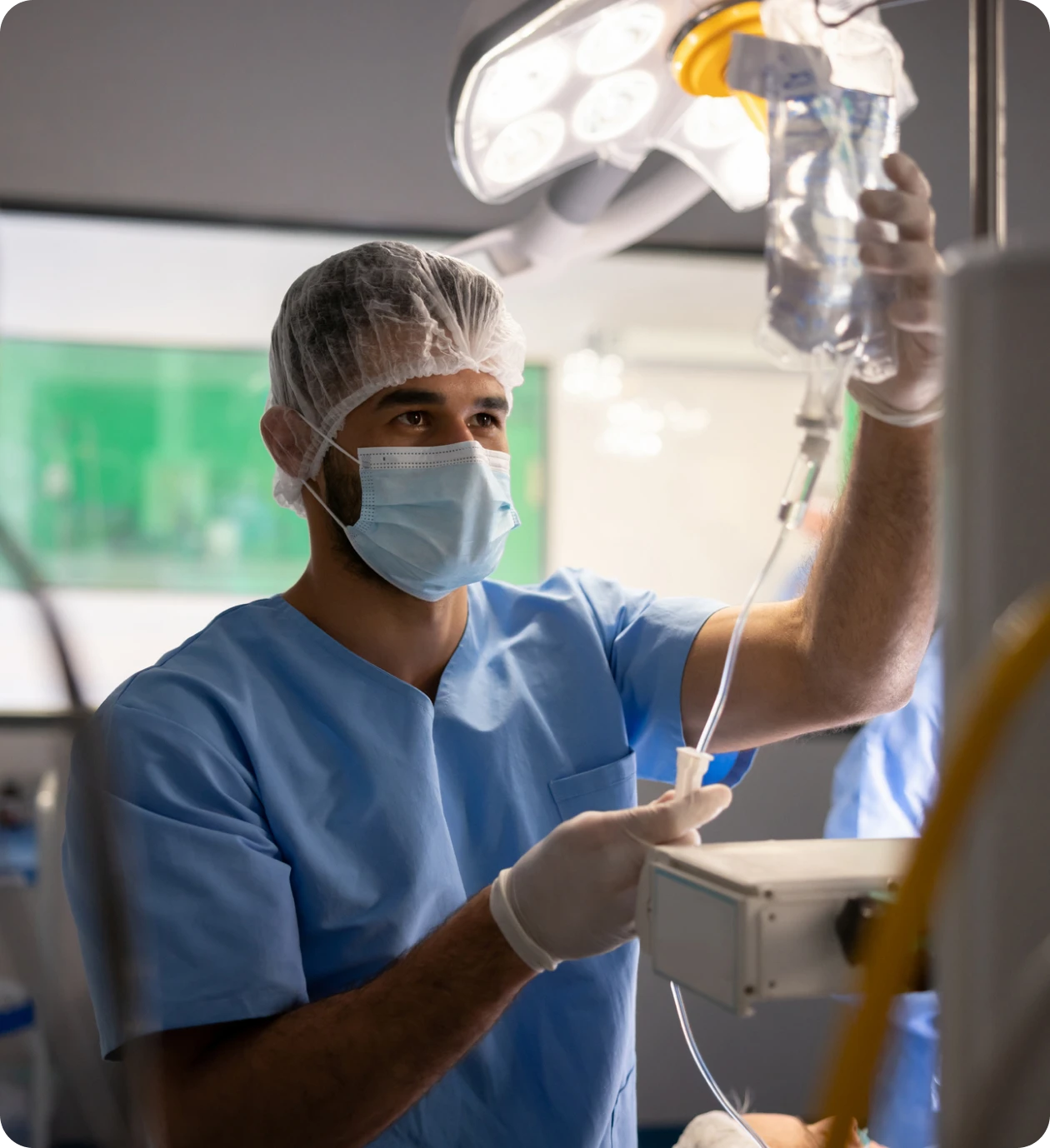 Medical professional in surgical attire with IV